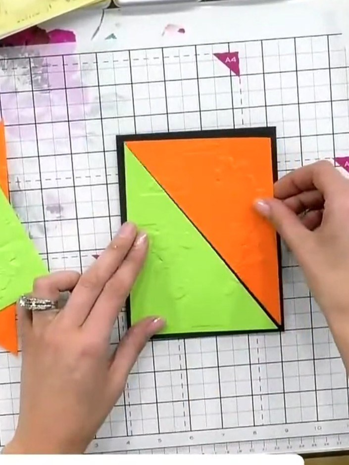 Step 4: Rotate the embossed triangular sections and arrange them to create a patchwork cross design. Position the lime