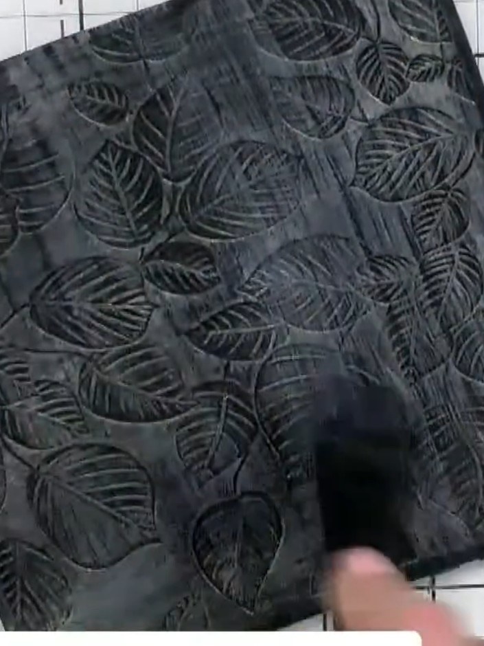 Step 7: Once the inks have dried completely, lightly sand the embossed surface to reveal the raised texture and enhanc
