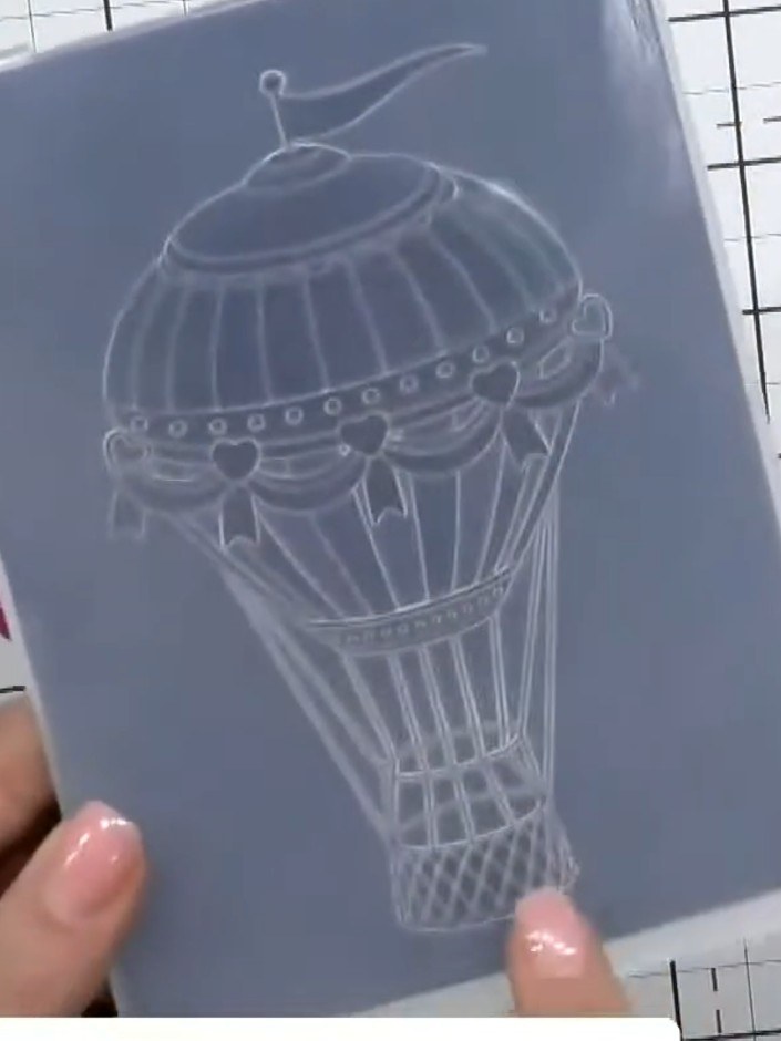 Step 2: Place the cardstock into the Love Is in the Air 3D embossing folder, ensuring the design is centred on your ca