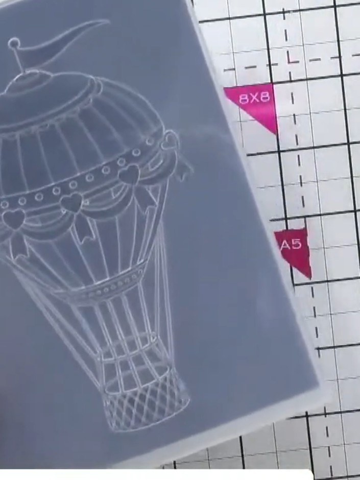 Step 4: Remove the embossed card from the folder and observe the dimensional hot air balloon detail that has been crea