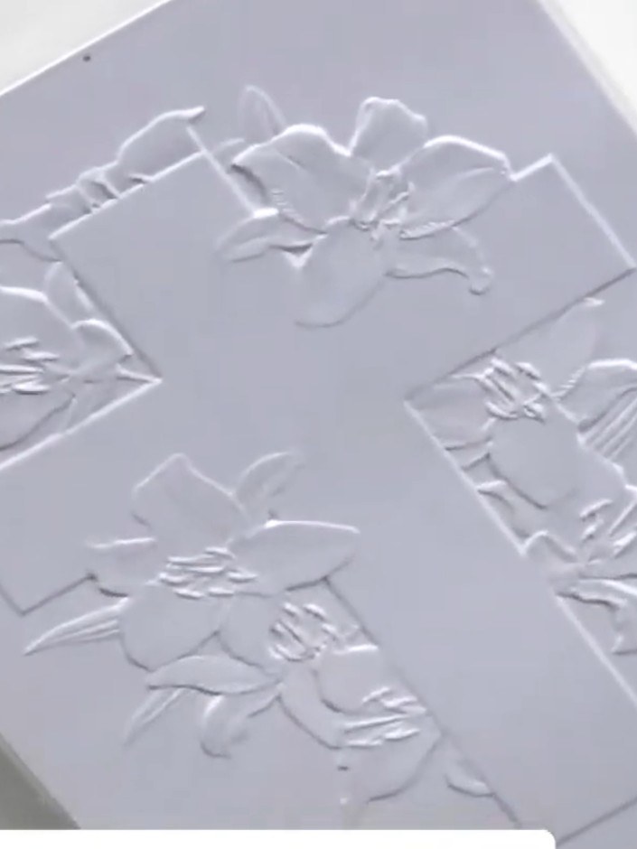 Step 4: Remove the embossed card from the folder and examine the dimensional cross detail. Check both the raised side 