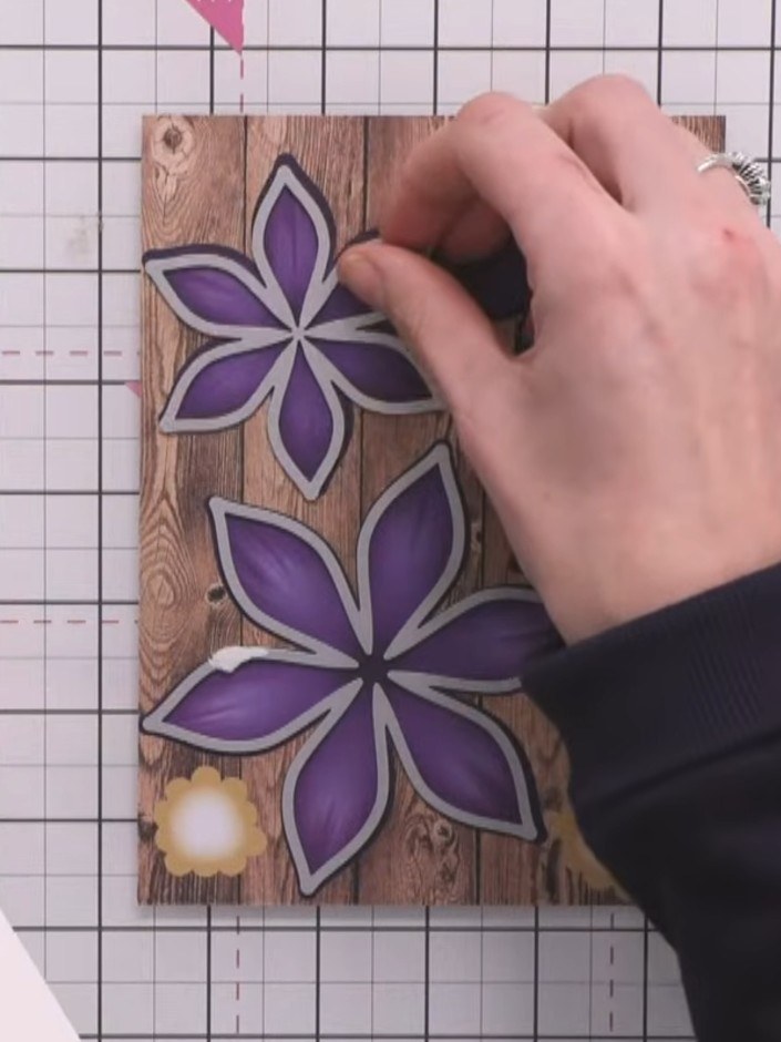 Step 1: Die-cut three sizes of clematis petals from purple cardstock using the largest, medium, and smallest dies from