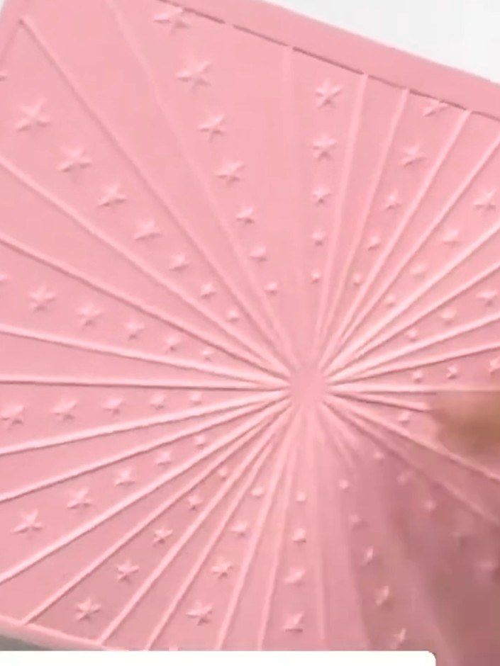 Step 2: Take the Carnival 3D embossing folder and apply ink directly to the raised surface of the folder using a swipi