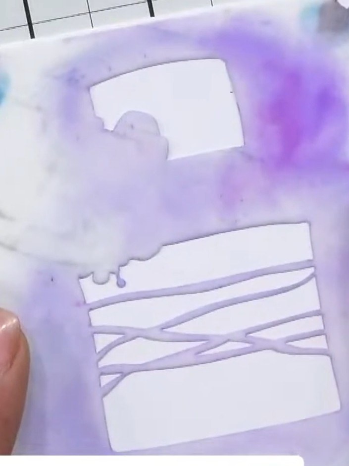 Step 1: Take your first layering stencil (numbered 1) and position it in the corner of your purple cardstock, aligning