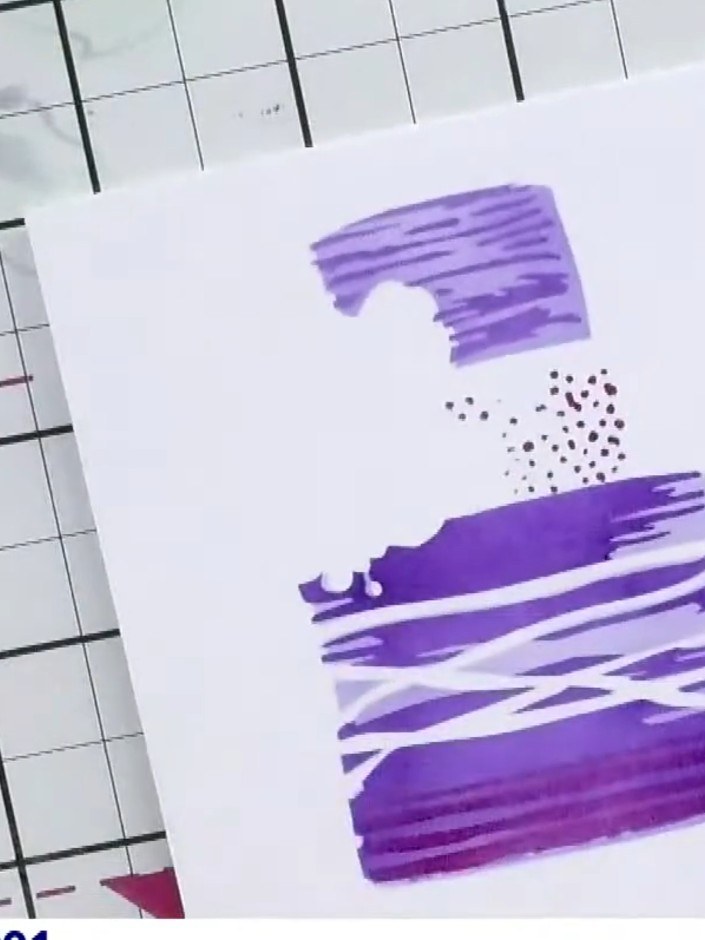 Step 8: Stamp the coordinating cake stamp in black ink in the centre of your layered design, positioning it over the p