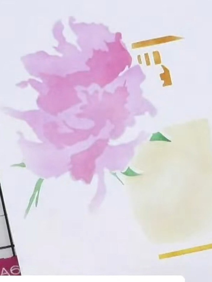 Step 2: Apply a pale pink watercolour wash through the stencil onto your card, creating soft floral shapes. Work gentl