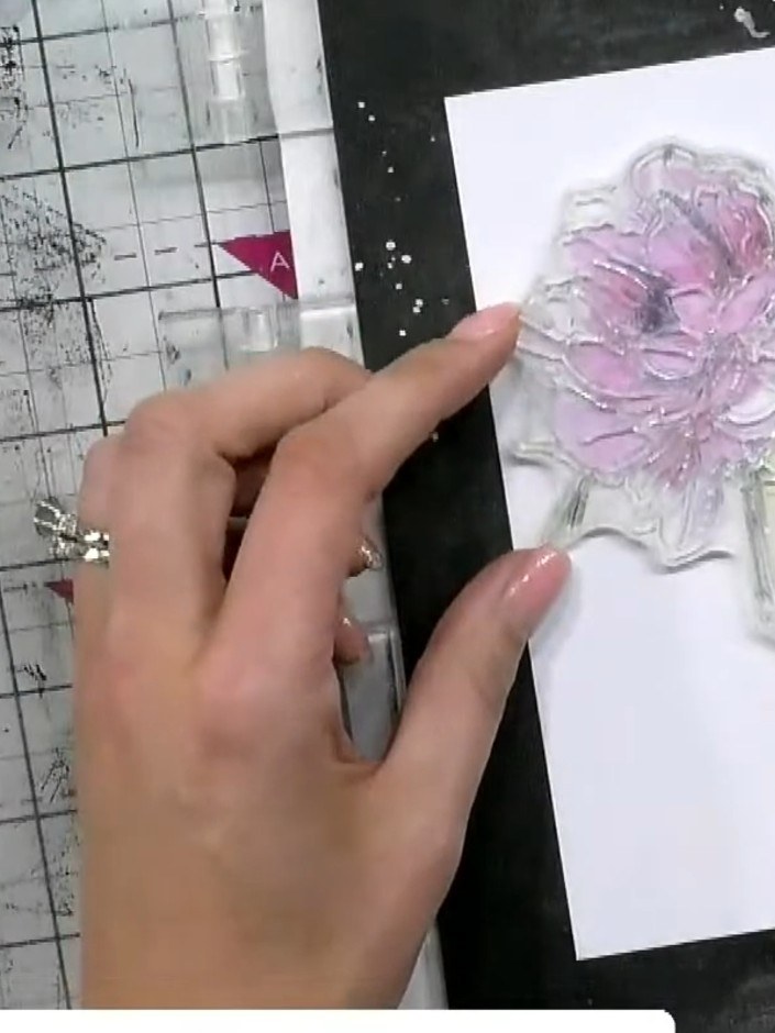 Step 4: Press harder with the same pink ink to deepen the colour on the flower. Add a light yellow wash to the perfume