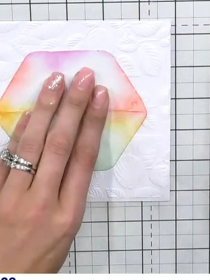 Step 4: Using a pink ink pad, brush colour around the exterior of the hexagon aperture to create a halo effect around 