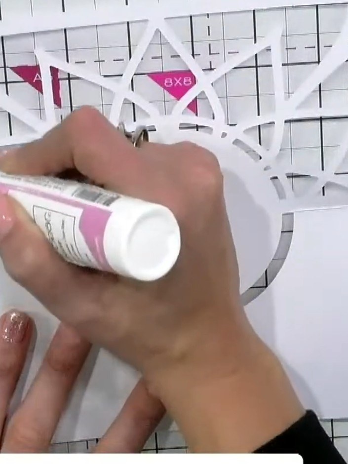Step 6: Apply glue around the edges of the coloured backing circle and position the lattice panel on top, ensuring it 
