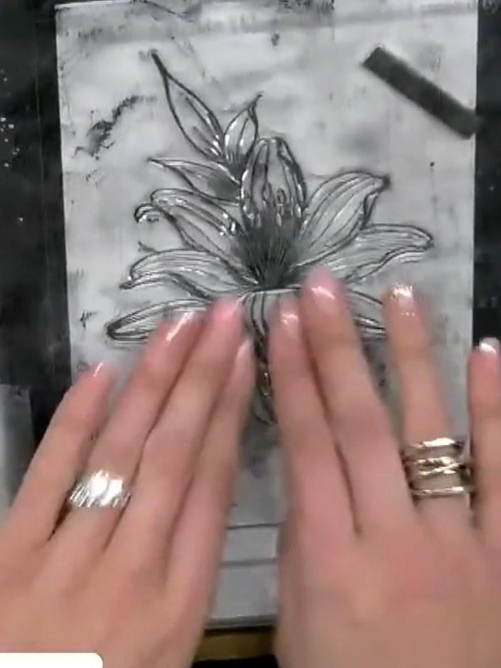 Step 2: Carefully fussy-cut around the stamped lily image using small scissors, leaving a small border of white space 