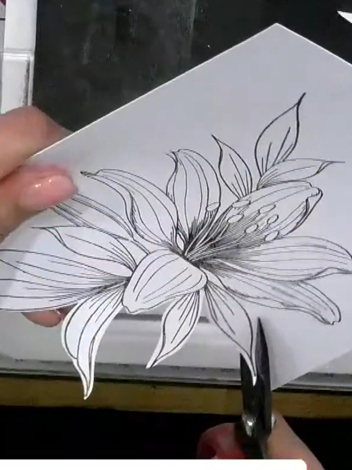 Step 3: Use the lattice die to cut a shaped card base from white cardstock. The die will create a decorative lattice p