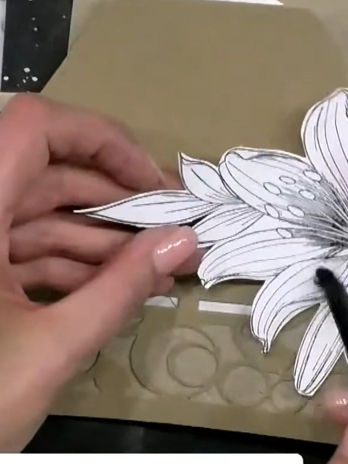 Step 5: Apply a small amount of adhesive to the back of the fussy-cut lily image. Use a precision adhesive or glue pen