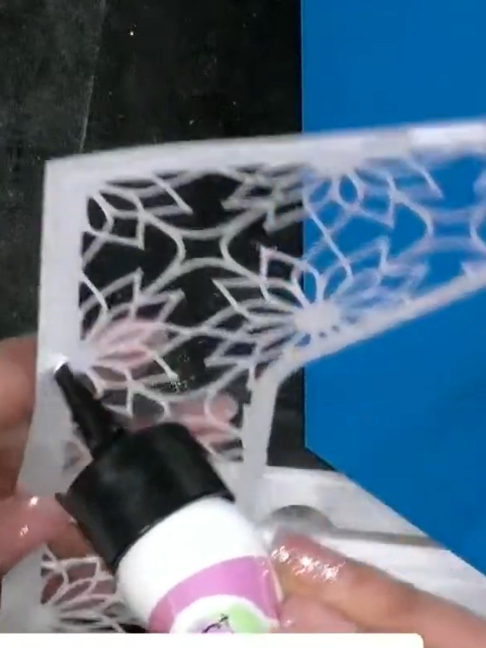Step 8: Using a fine brush, add a touch of pink ink to the centre of the flower on your die-cut stencil design for add