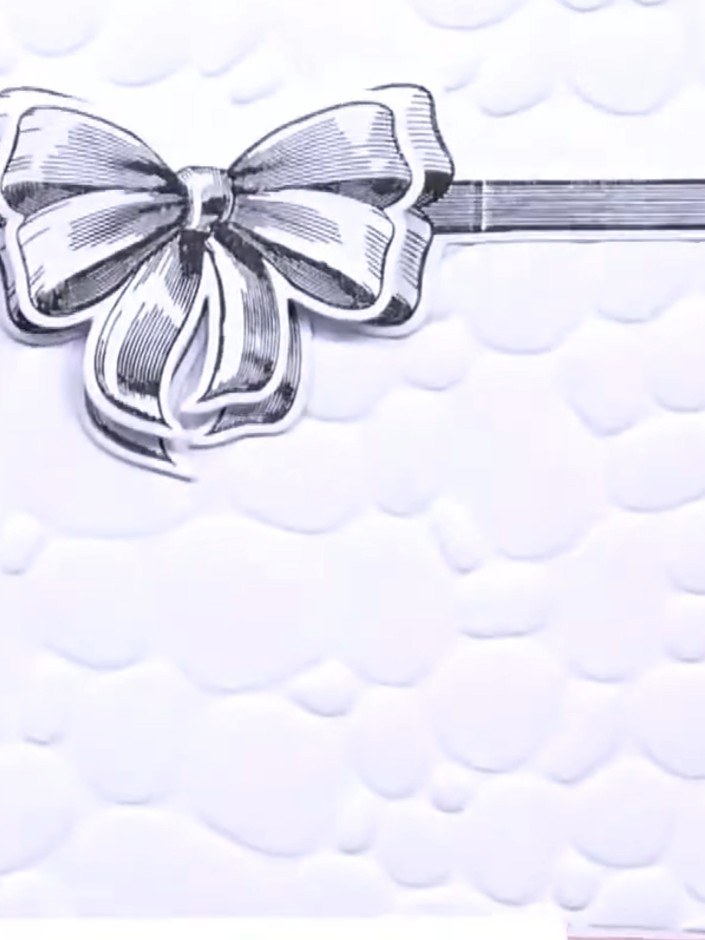 Step 6: Mount the embossed and watercoloured panel onto a pink card base to complete your card. The textured pebble da