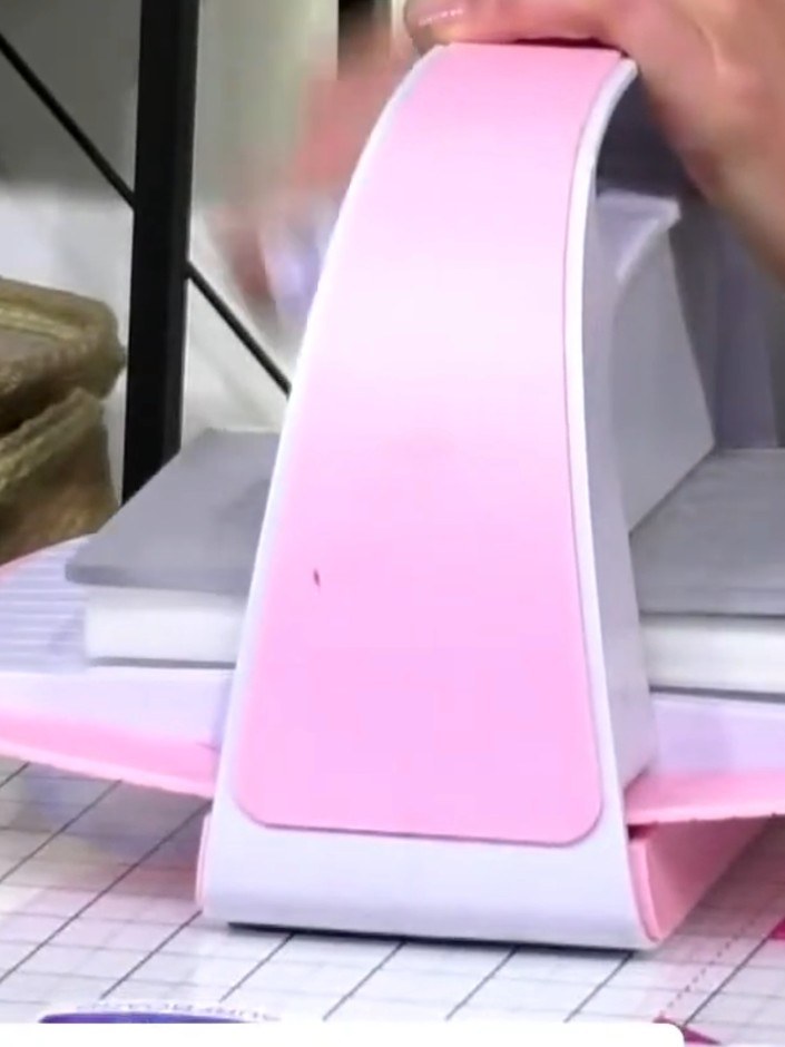 Step 2: Place your cardstock with the embossing folder into the die-cutting machine. Run it through the machine to cre