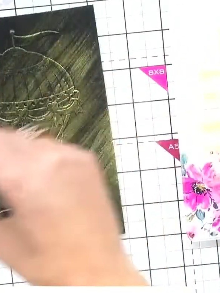 Step 3: Apply confetti ink pad to various areas of the embossed hot air balloon design using a dry brushing technique.