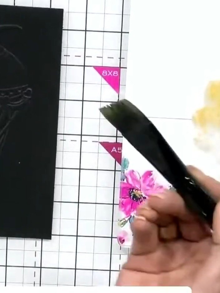 Step 5: Use a tissue to gently burnish back some of the watercolour for a blended effect on the embossed hot air ballo