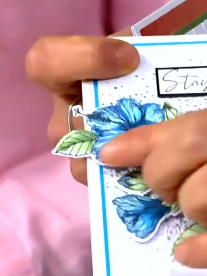 Step 1: Select the hibiscus stamp set and identify stencil one. Apply teal ink to the stencil using a light pressing m