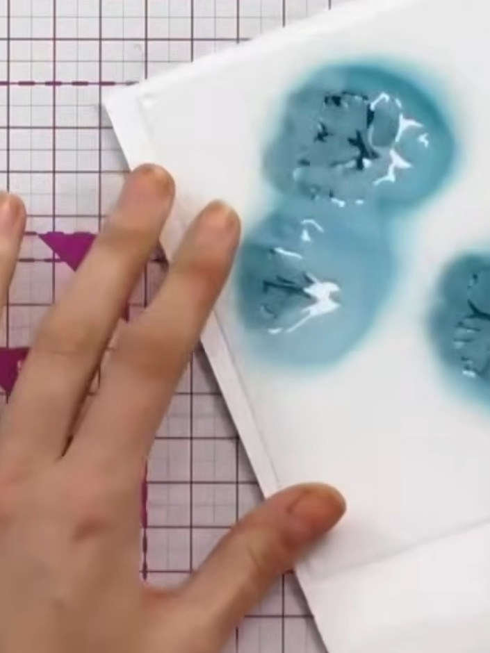 Step 3: Continue applying the remaining stencils (three through six) in sequence, using the numbered guides on the bac