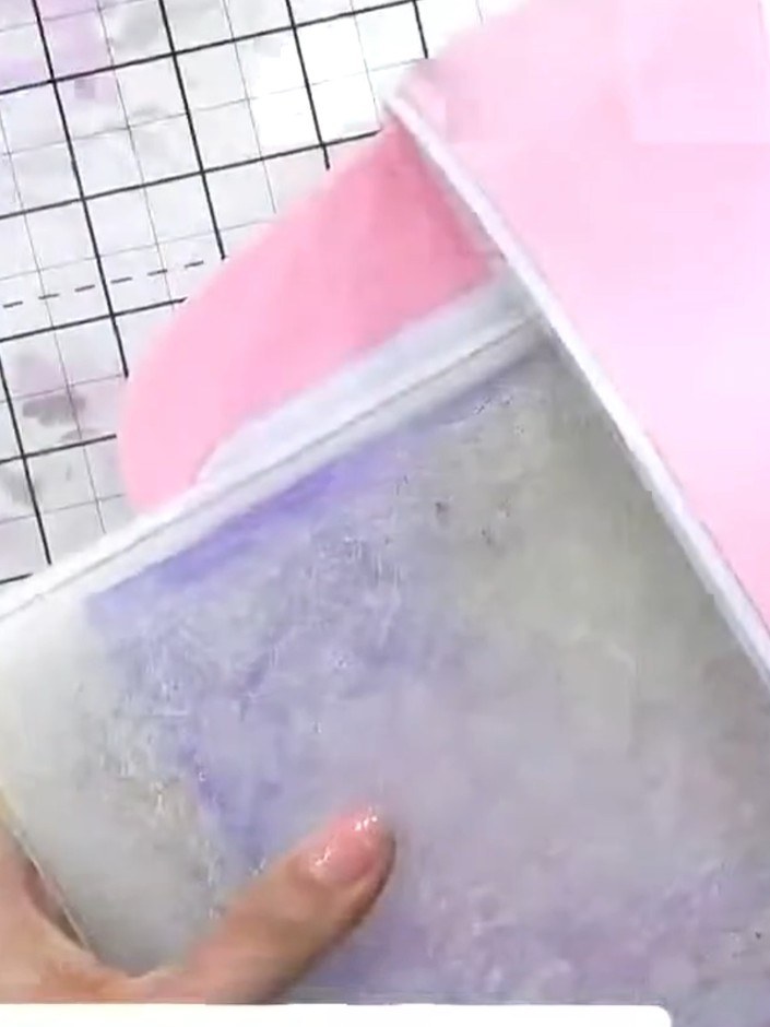 Step 6: Run the cardstock through your embossing machine to transfer the colour and create the embossed pebble dash te