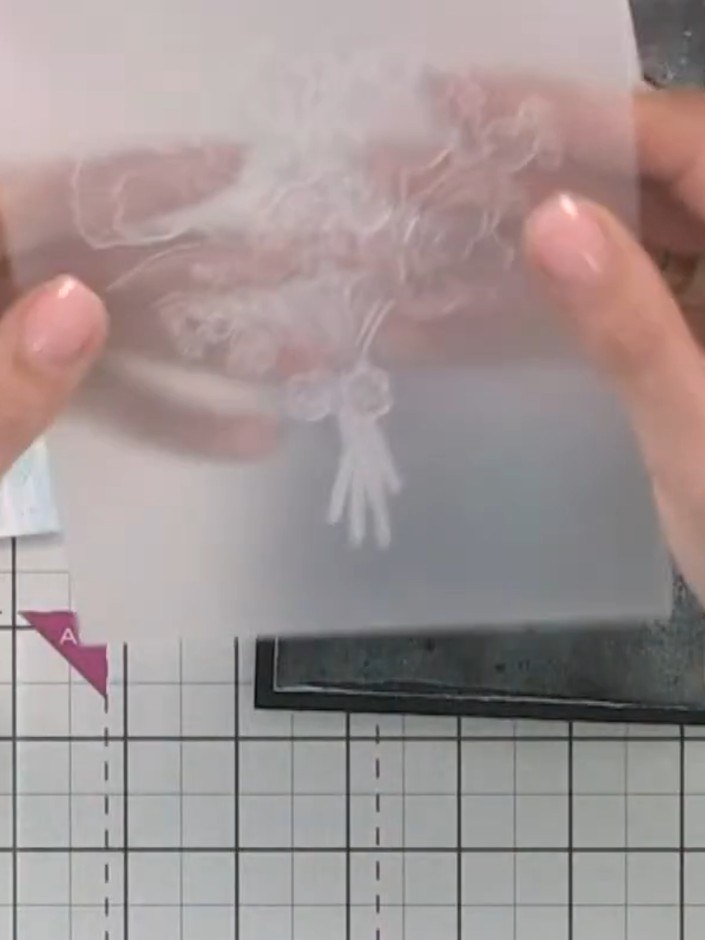 Step 5: Place your watercoloured card inside the embossing folder, positioning it so the debossed (raised) side of the