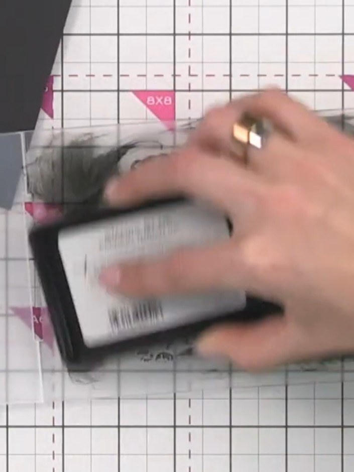 Step 9: Use a blending tool to work over the stamped image, blending and softening the confetti ink colours into the w