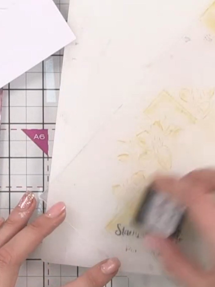 Step 5: Run the embossing folder with your card inside through your die-cutting machine to create the embossed design 