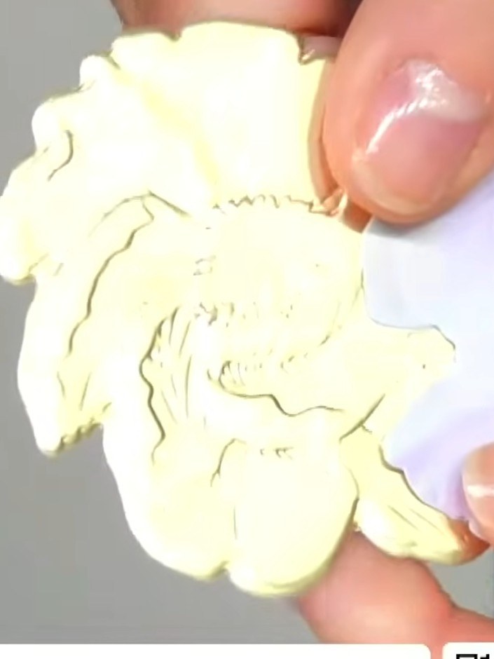 Step 1: Remove the die from the embossing folder. Insert a piece of gold or coloured card stock into the embossing fol