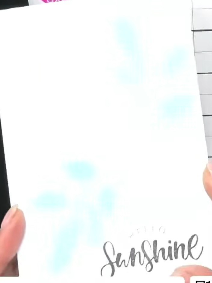 Step 7: Stamp a sentiment such as 'Hello Sunshine' onto white cardstock using black ink. Add an optional drop shadow b