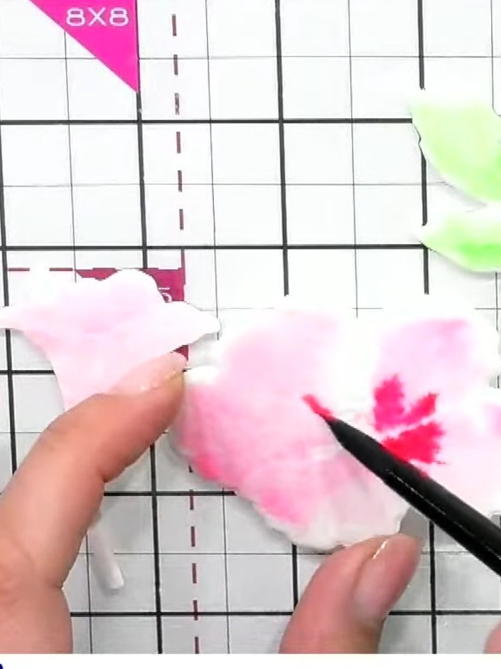 Step 6: If you're unhappy with the watercolour result, use a tissue to gently lift and pull back the colour from the e