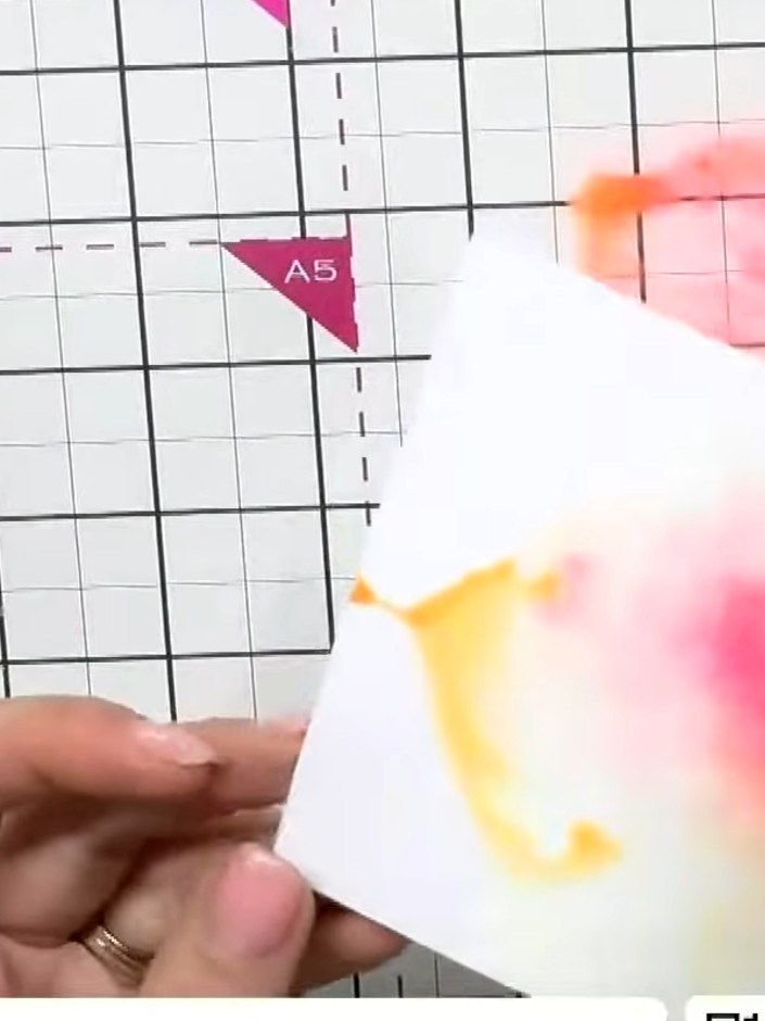 Step 9: Mount the painted flower pieces onto a white card base with layered backing papers to complete your neon water