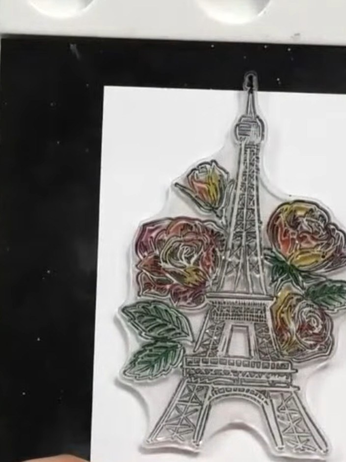Step 5: Stamp the Paris tower outline in black ink onto white cardstock to add architectural detail. The Eiffel Tower 