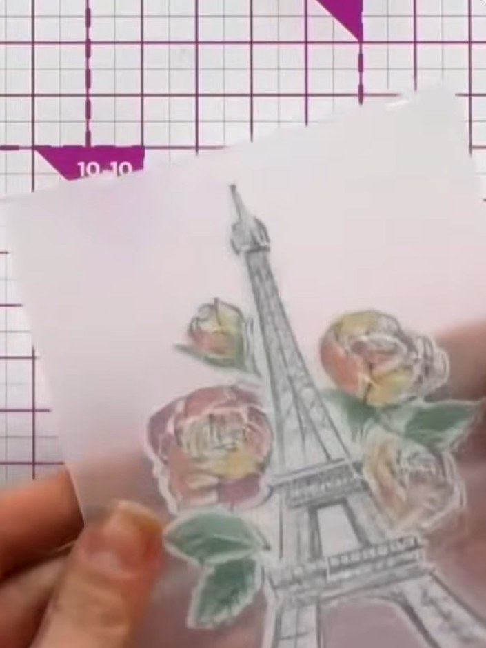 Step 7: Place the die-cut Paris tower and floral image into the embossing folder. Run through your die-cutting machine