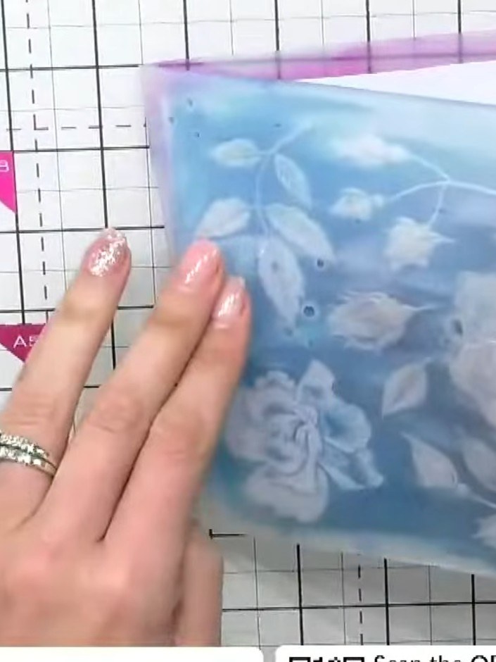 Step 6: Place your inked card into the embossing folder and run it through your die-cutting machine on the appropriate