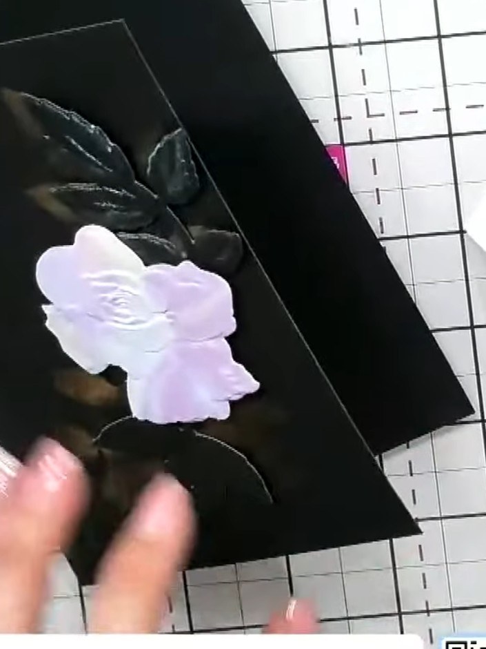 Step 6: Add a stamped sentiment to your card. Position the 'Hello Sunshine' sentiment stamp below the embossed flowers
