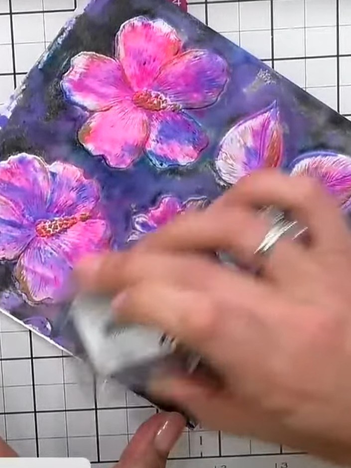 Step 7: Ink the flat back side of the embossing folder with a black ink pad, covering the entire surface with good col