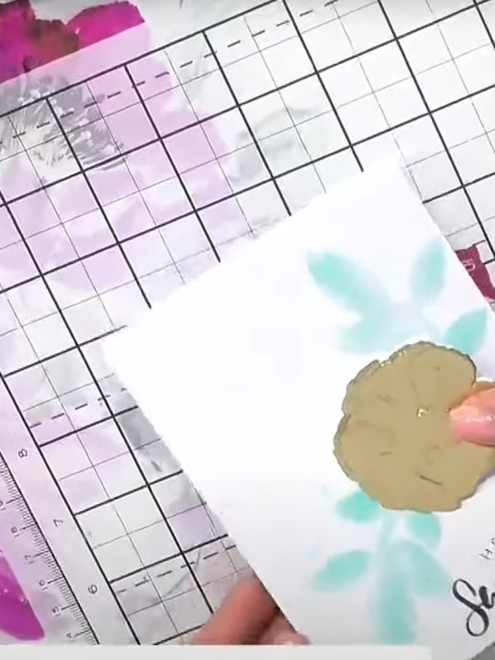 Step 1: Use the stencil from the Dainty Hibiscus embossing folder set to create a colourful background on your white c
