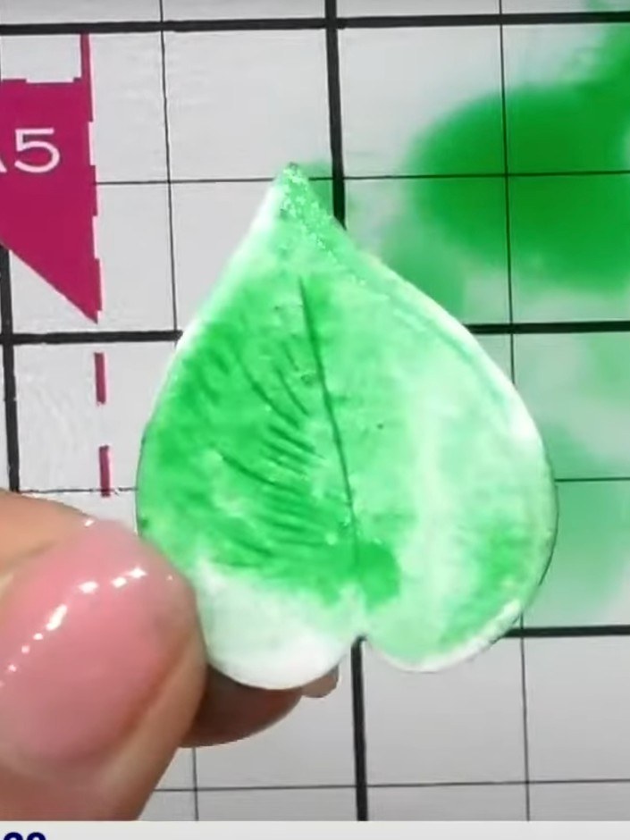 Step 3: Dip the wet embossed piece directly into the green ink pad to pick up the pigment. The wet embossing will abso