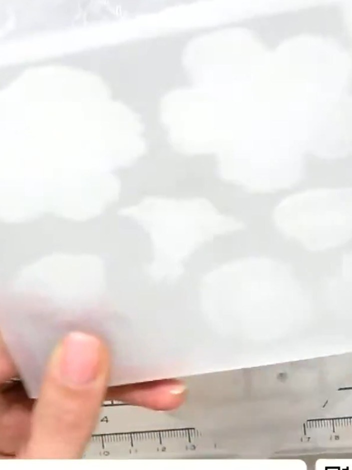 Step 1: Place your white card stock into the embossing folder with the die still taped in position. Ensure the card st