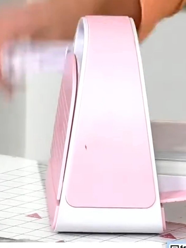 Step 2: Run your embossed card through the die-cutting machine using the standard plate settings. The pink and white d