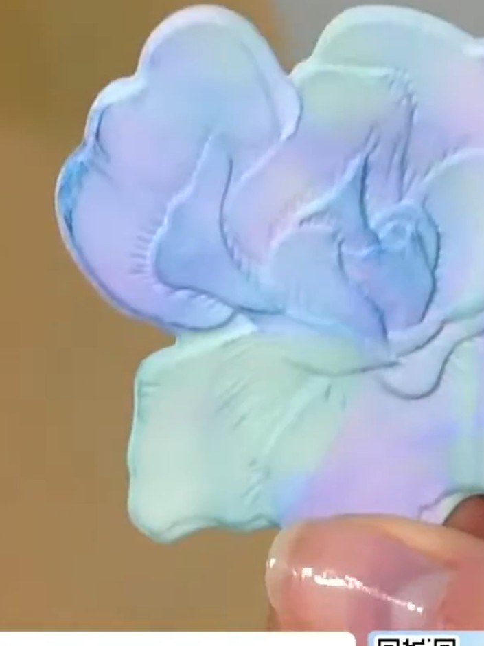 Step 6: Adhere the embossed flower elements to your card base using adhesive. Position the die-cut flowers as desired 