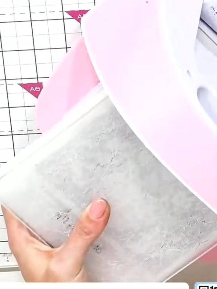 Step 1: Run your watercolour card stock through your die-cutting machine using the embossing folder with the die taped