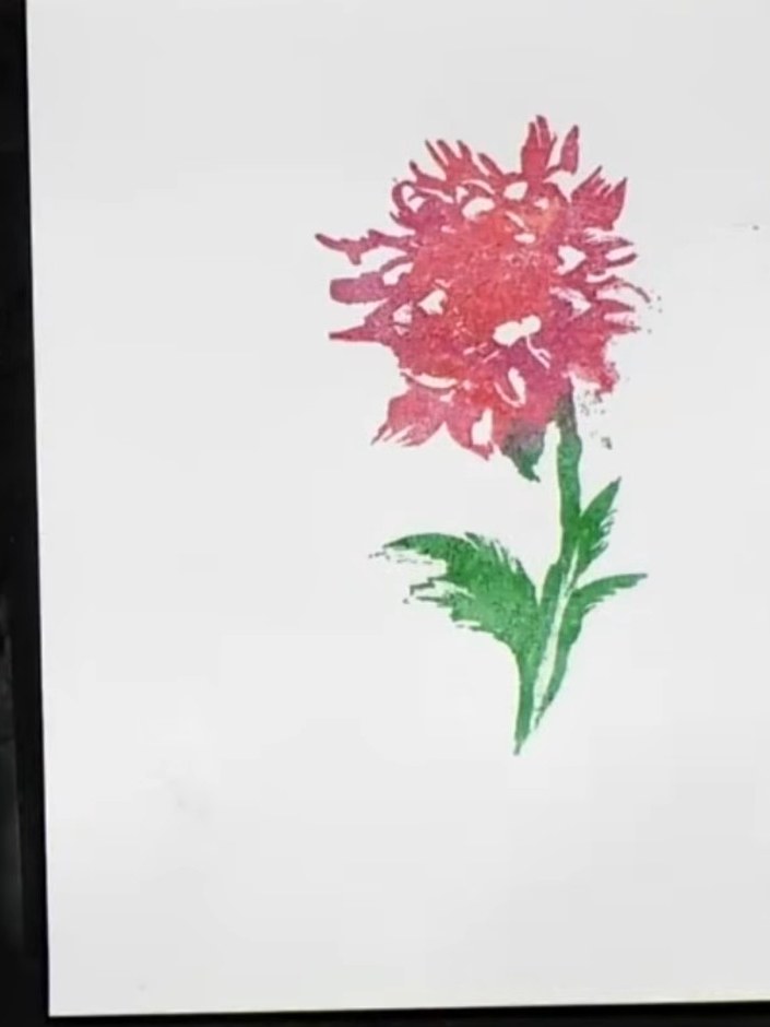 Step 2: Lightly spray the inked card with water to allow the colours to blend and spread naturally. Don't worry about 