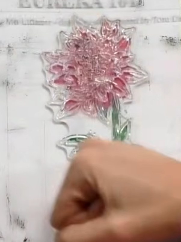Step 6: For extra watercolour bleed effects, spray additional water on top of the stamped flower. This will create mor