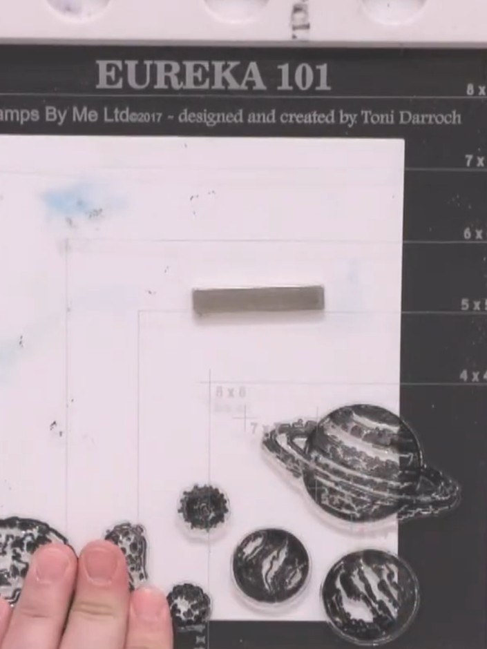 Step 2: Die cut two circles from black card and patterned paper. Use the largest circle for the base and a smaller cir