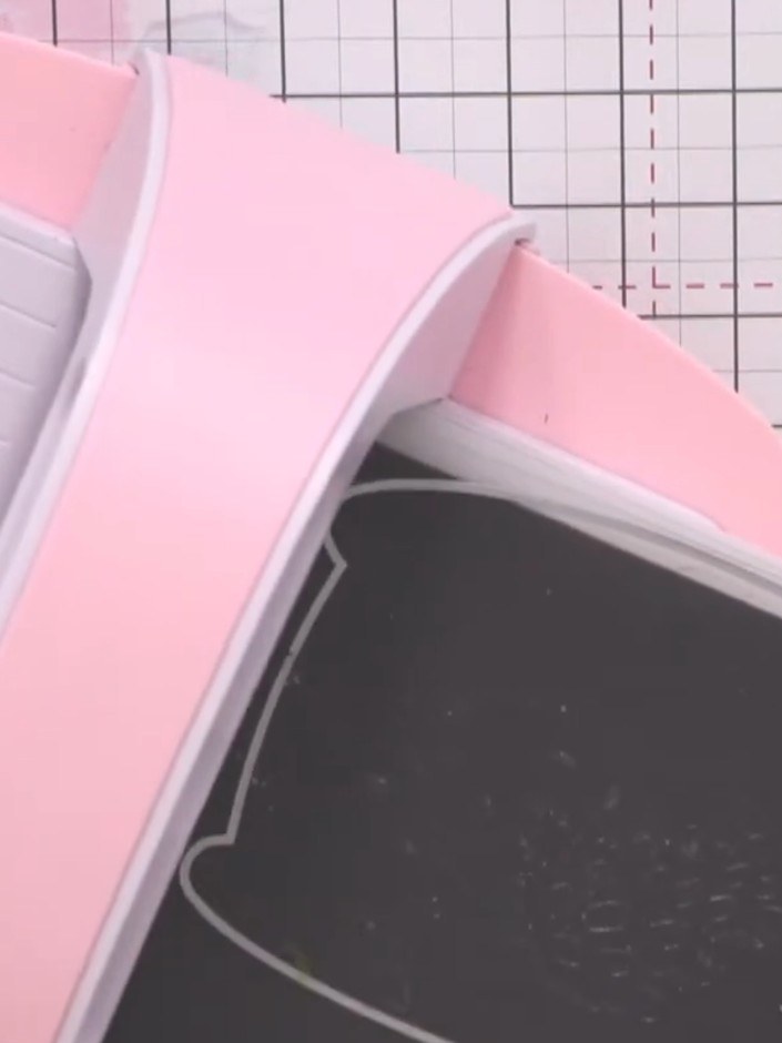Step 2: Place the monster outline die on the black card and run it through the die-cutting machine. Remove the cut-out