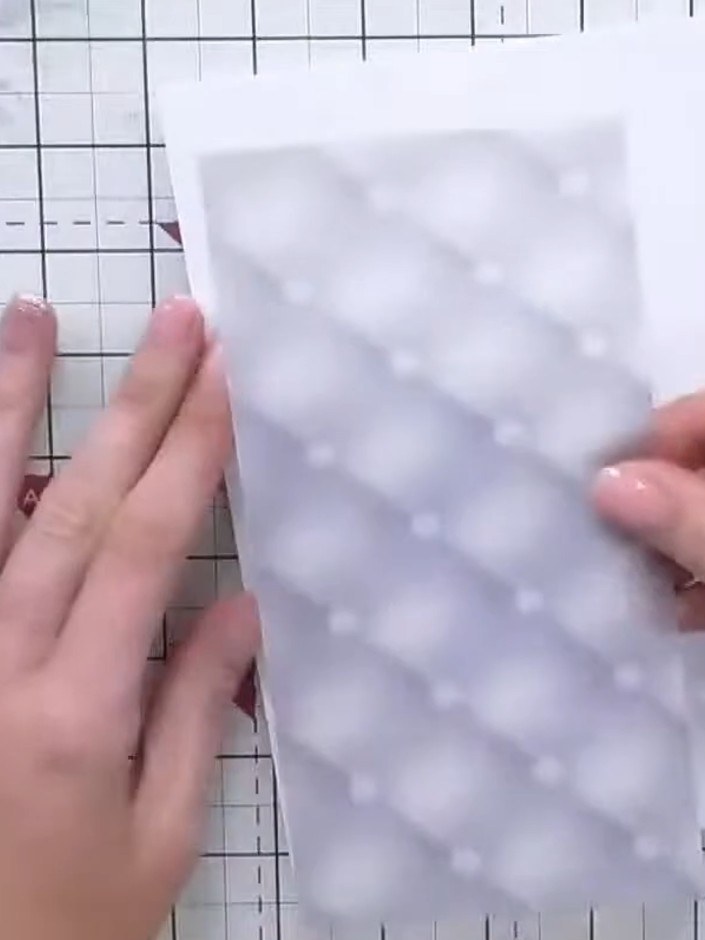Step 1: Create a top-folding note card base using white cardstock. Cut a piece of the vellum with the purple diamond p
