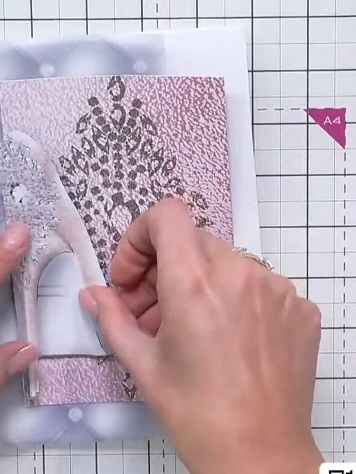 Step 5: Position the vellum element with the silver glitter shoe and diamond design on the left side of the card front