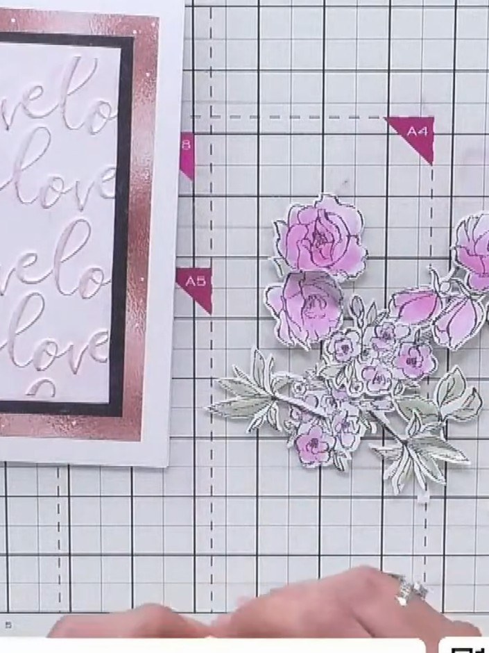 Step 2: Punch or cut circles from the stamped floral sheet to create individual flower elements. The pink roses can be
