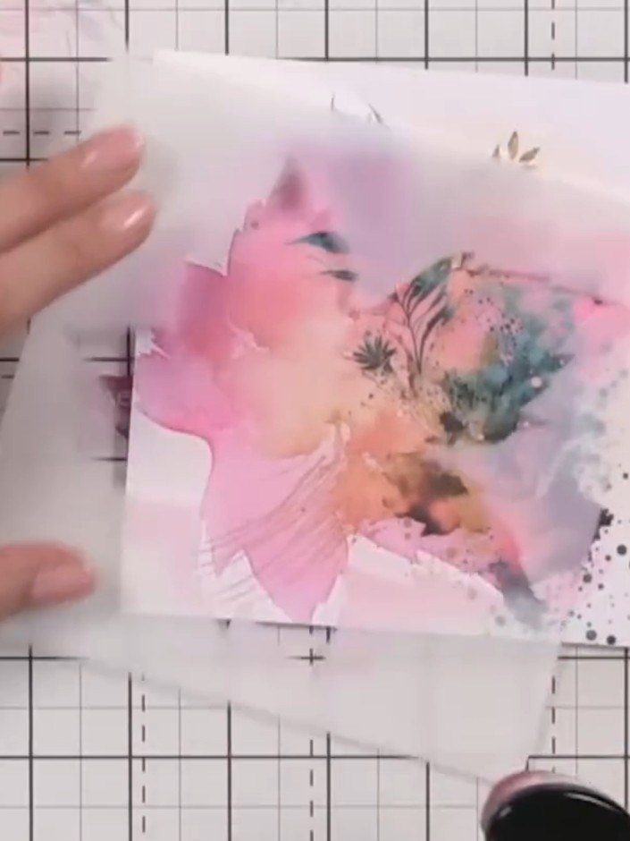 Step 7: Use a tissue or cloth to dab away excess water from the watercolour design, blending the pink, peach and flora